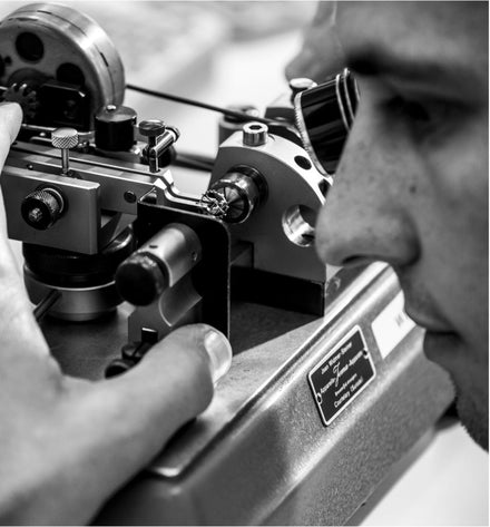 H Moser Cie Watchmaker adjusting watch