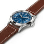 The Hamilton Khaki Field Auto 38mm features a stainless steel case, navy sunray dial with white numerals and date display, plus a brown leather strap with white stitching. Powered by the precise H-10 automatic movement.