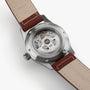 Back view of the Hamilton Khaki Field Auto 38mm, revealing its H-10 automatic movement through a transparent caseback, brown leather straps, and visible engraved markings.