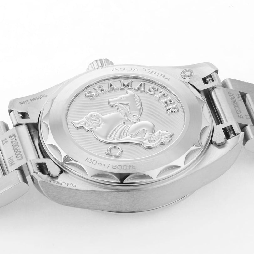 Close-up of the OMEGA Seamaster Aqua Terra 150Ms caseback, showing the engraved seahorse logo, watch specifications, metal bracelet, and elegant diamond indexes.