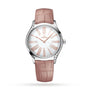 The OMEGA De Ville Trésor is a silver wristwatch with a pink leather strap, mother-of-pearl dial, diamond-paved bezel, white face, and rose gold Roman numerals and hands.