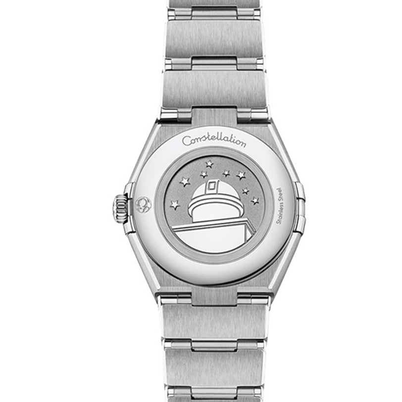 Back view of an OMEGA Constellation wristwatch featuring a stainless steel case engraved with an observatory, stars, and the word “Constellation,” highlighting the collection’s timeless elegance.