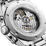 Close-up of a Longines Conquest Chronograph, showcasing its stainless steel case and transparent back that reveals the self-winding movement.