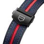 Close-up of the TAG Heuer Special Edition Connected Calibre E4 x Oracle Red Bull Racing strap: blue fabric, red center stripe, and black clasp with shield logo—designed to pair with racing-inspired watch faces.