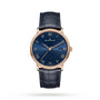 The Blancpain Villeret Ultraplate features a blue dial with Roman numerals, ultra-thin red gold case, date at 3 o’clock, and blue leather strap. The Blancpain logo is displayed on the dial.
