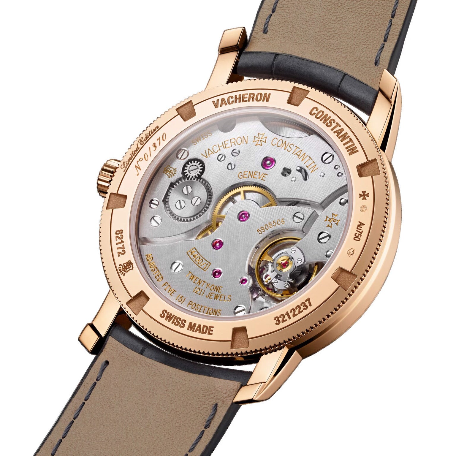 The back view of the Vacheron Constantin Traditionnelle Manual-winding showcases its mechanical movement, intricate engravings, a brown leather strap, and an 18K pink gold case.