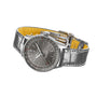 The Breitling Navitimer Automatic 36, featuring a stainless steel case, grey leather strap, anthracite dial with white markers, and date window, is displayed at an angle against a white background.
