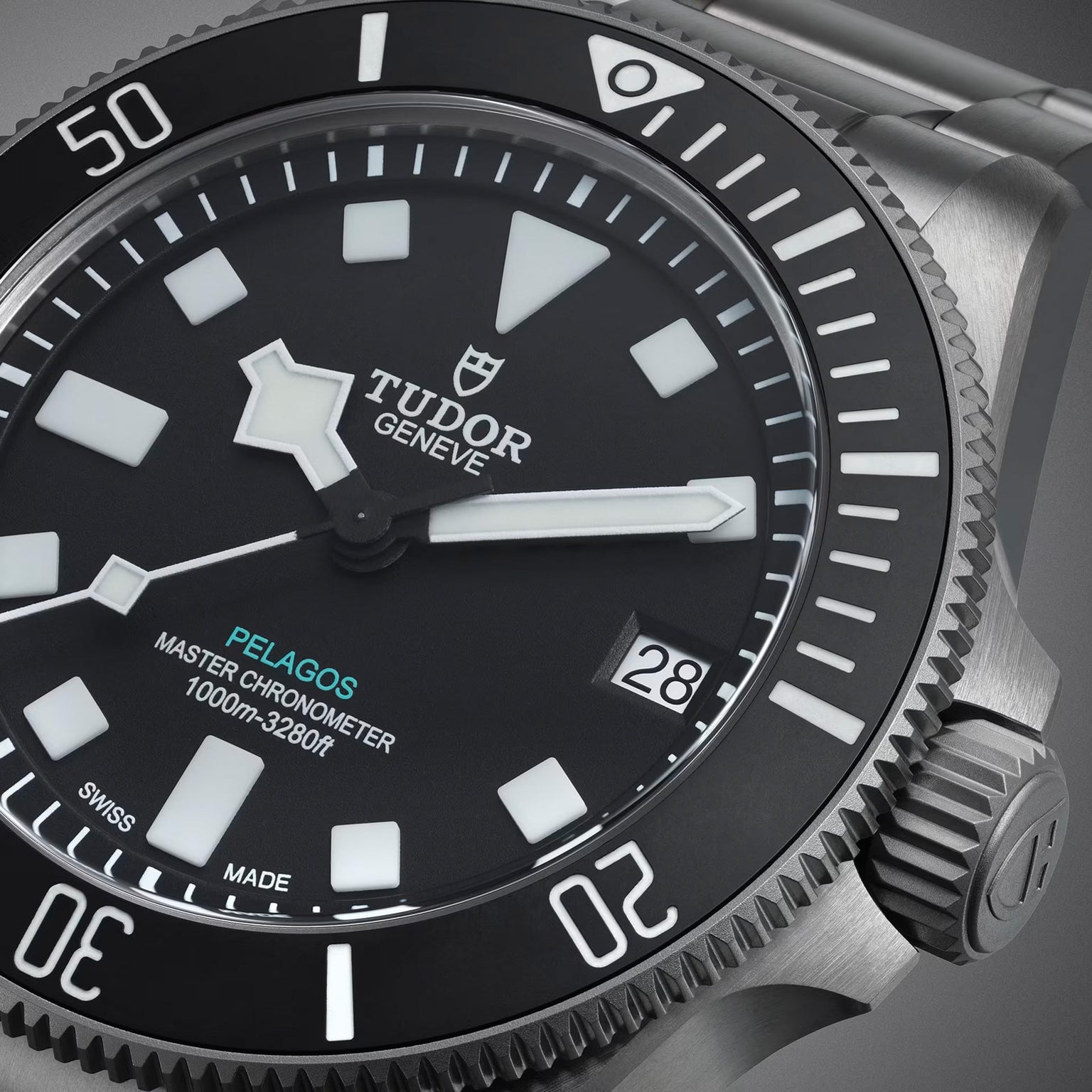 Close-up of a TUDOR Pelagos Ultra dive watch highlighting the dial, bezel, and date window at 3 o’clock.