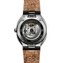 Back view of the ID Geneve Circular S - Silver Brushed wristwatch, showcasing its exposed mechanical movement and cork-patterned strap.