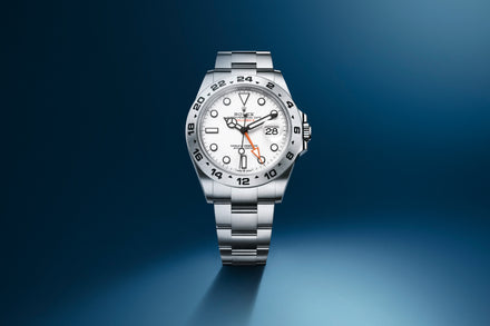 Rolex Explorer watch with white dial showcased on a blue gradient background